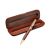 Genuine wooden ballpoint pen features a handsome wood barrel, double plated gold accents and an engraved center band complete in an attractive grained wood display case.  Black Ink 0.7mm Medium Point